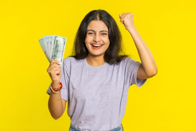 The Hidden Math Behind Life-Changing Prize Machines? rich happy indian woman winner waving money dollar cash like fan income wealth success business pleased young banknotes bills 320112127